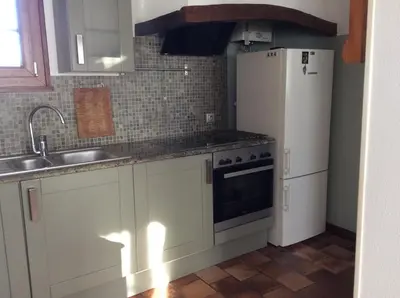 Cuisine ou kitchenette dans l'établissement La maison de Chantal
