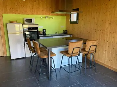 Cuisine ou kitchenette dans l'établissement Lodge détente et spa