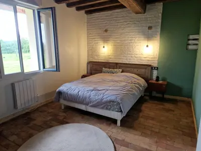 Un ou plusieurs lits dans un hébergement de l'établissement Gite ferme du meix guillot