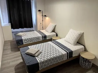 Un ou plusieurs lits dans un hébergement de l'établissement Maison au coeur du village