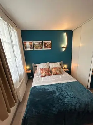 Un ou plusieurs lits dans un hébergement de l'établissement Le nid de Sitelle, appartement, piscine et sauna
