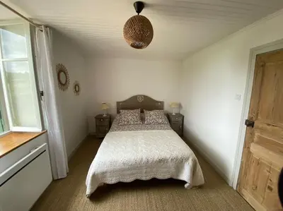 Un ou plusieurs lits dans un hébergement de l'établissement Petite maison de charme à Thury