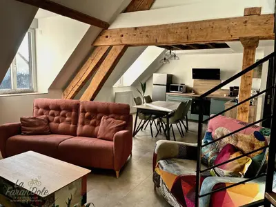 Coin salon dans l'établissement La Faran'dole - Confortable duplex