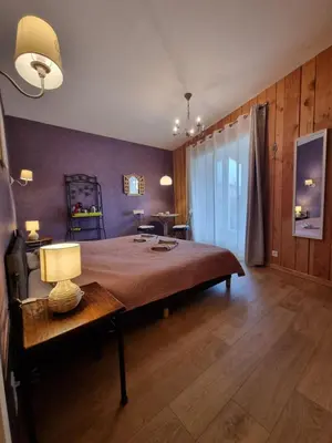 Un ou plusieurs lits dans un hébergement de l'établissement Les Chambres d'Anna
