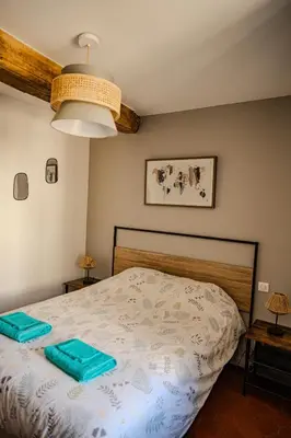 Un ou plusieurs lits dans un hébergement de l'établissement Gîte des Cadoles