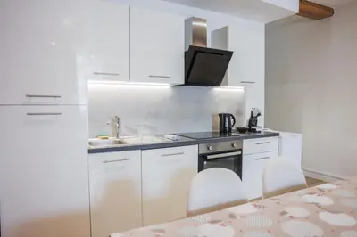 Cuisine ou kitchenette dans l'établissement L'immeuble Carnot
