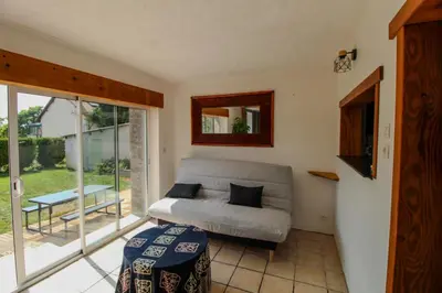 Coin salon dans l'établissement Charmante Maison avec Terrasse