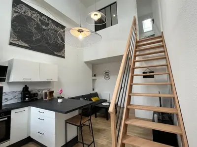 Cuisine ou kitchenette dans l'établissement Appartement avec du cachet
