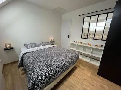 Un ou plusieurs lits dans un hébergement de l'établissement Appartement avec du cachet