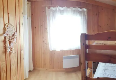 Un ou plusieurs lits dans un hébergement de l'établissement Gîte les 4 saisons - Intérieur bois - Lac de Chalain