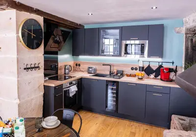 Cuisine ou kitchenette dans l'établissement La Forge - Clim - Jacuzzi - Hyper Centre