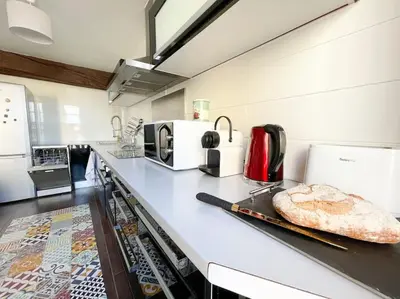 Cuisine ou kitchenette dans l'établissement Le St Laurent - Bord de Saône