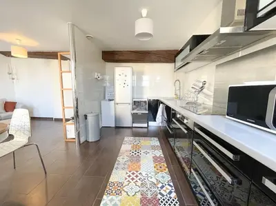 Cuisine ou kitchenette dans l'établissement Le St Laurent - Bord de Saône