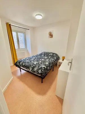 Un ou plusieurs lits dans un hébergement de l'établissement appartement confort
