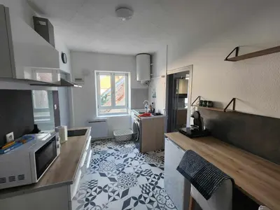 Cuisine ou kitchenette dans l'établissement Le cocon de Julia
