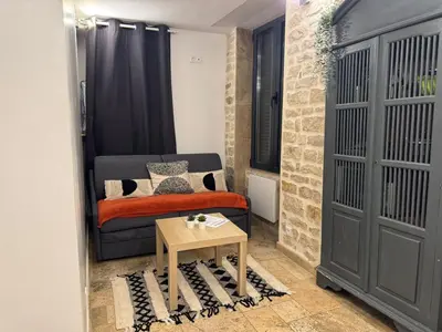 Un ou plusieurs lits dans un hébergement de l'établissement Appartement de charme Le Coin Caché