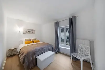 Un ou plusieurs lits dans un hébergement de l'établissement Eros des Vignes Appartement 60m2