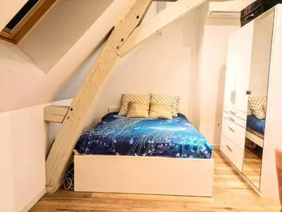 Un ou plusieurs lits dans un hébergement de l'établissement La chambre des petits voyageurs