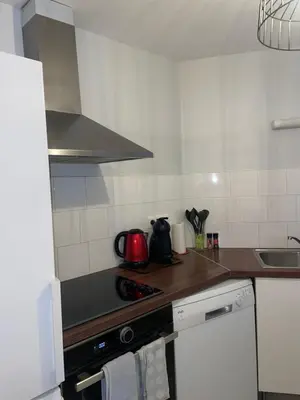 Cuisine ou kitchenette dans l'établissement Appartement meublé - 2 Chambres
