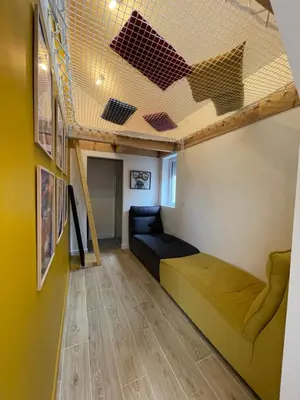 Coin salon dans l'établissement Maison avec Jacuzzi privé