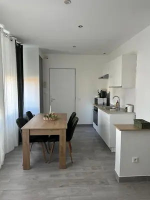 Cuisine ou kitchenette dans l'établissement L'Immeuble de l'Avenue