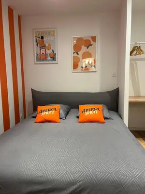 Un ou plusieurs lits dans un hébergement de l'établissement Le Spritz