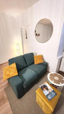 Coin salon dans l'établissement Le Petit Polinois