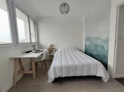Un ou plusieurs lits dans un hébergement de l'établissement Appartement 3 chambres - Drapeau