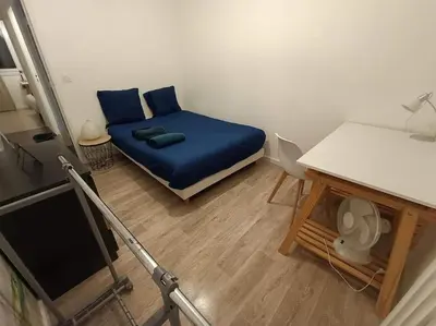 Un ou plusieurs lits dans un hébergement de l'établissement Appartement 3 chambres - Drapeau