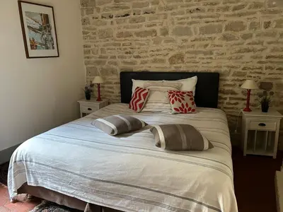 Un ou plusieurs lits dans un hébergement de l'établissement B&B Chez Marie