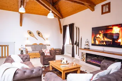 Coin salon dans l'établissement Gîte Du Pré Pommier - Clim - Piscine - Sauna