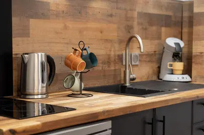Cuisine ou kitchenette dans l'établissement Le Sigorgne Centre-ville Gare