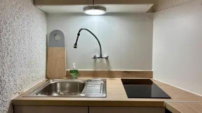 Cuisine ou kitchenette dans l'établissement Au coeur d'Autun