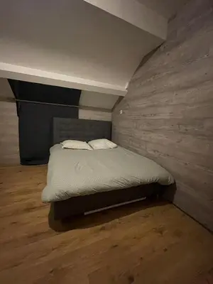 Un ou plusieurs lits dans un hébergement de l'établissement Logement 20 min de Dijon Fenay