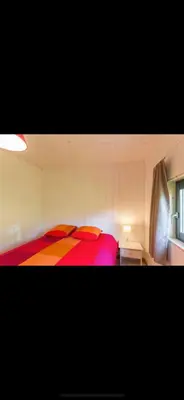 Un ou plusieurs lits dans un hébergement de l'établissement Au Chalet Bourguignon 5