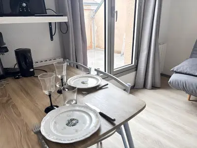 Coin salon dans l'établissement T2 23m2 Confort calme Centre ville Paray app 408