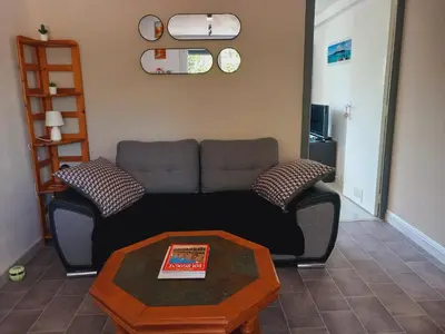 Coin salon dans l'établissement Le petit Appartement