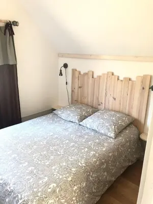 Un ou plusieurs lits dans un hébergement de l'établissement Chalet Sérénité