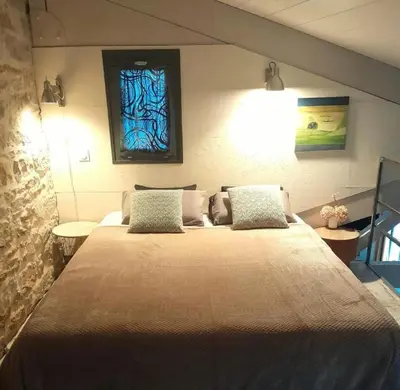 Un ou plusieurs lits dans un hébergement de l'établissement Holiday Loft 58