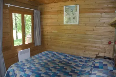 Un ou plusieurs lits dans un hébergement de l'établissement Hotel Camping sur Yonne