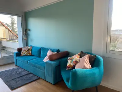 Coin salon dans l'établissement Appartement 4p avec garage privé