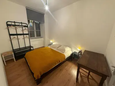 Un ou plusieurs lits dans un hébergement de l'établissement Appartement cosy centre Lons Le Saunier