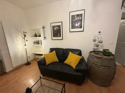 Coin salon dans l'établissement Appartement cosy centre Lons Le Saunier