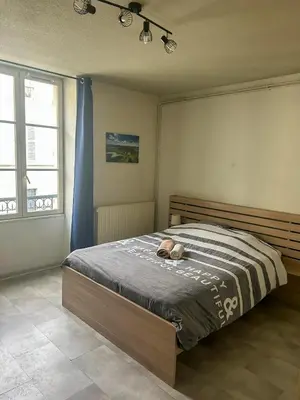 Un ou plusieurs lits dans un hébergement de l'établissement Studio du Jura