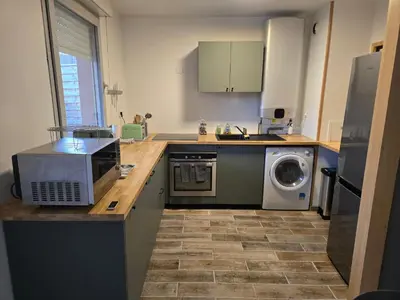 Cuisine ou kitchenette dans l'établissement La Résidence des Poètes