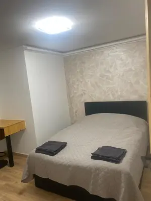 Un ou plusieurs lits dans un hébergement de l'établissement Chouette Appartement 21