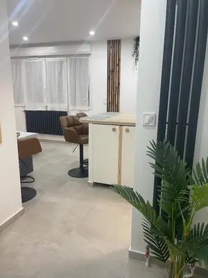 Coin salon dans l'établissement Chouette Appartement 21