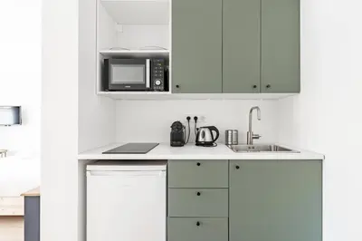 Cuisine ou kitchenette dans l'établissement Le Valeureux - Cosy en hypercentre