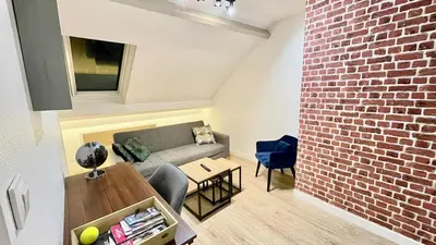 Coin salon dans l'établissement Le Chablis - Proche Centre & CHU, avec MiniBar