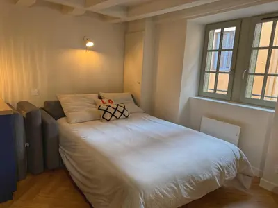 Un ou plusieurs lits dans un hébergement de l'établissement Le Studio Madeleine